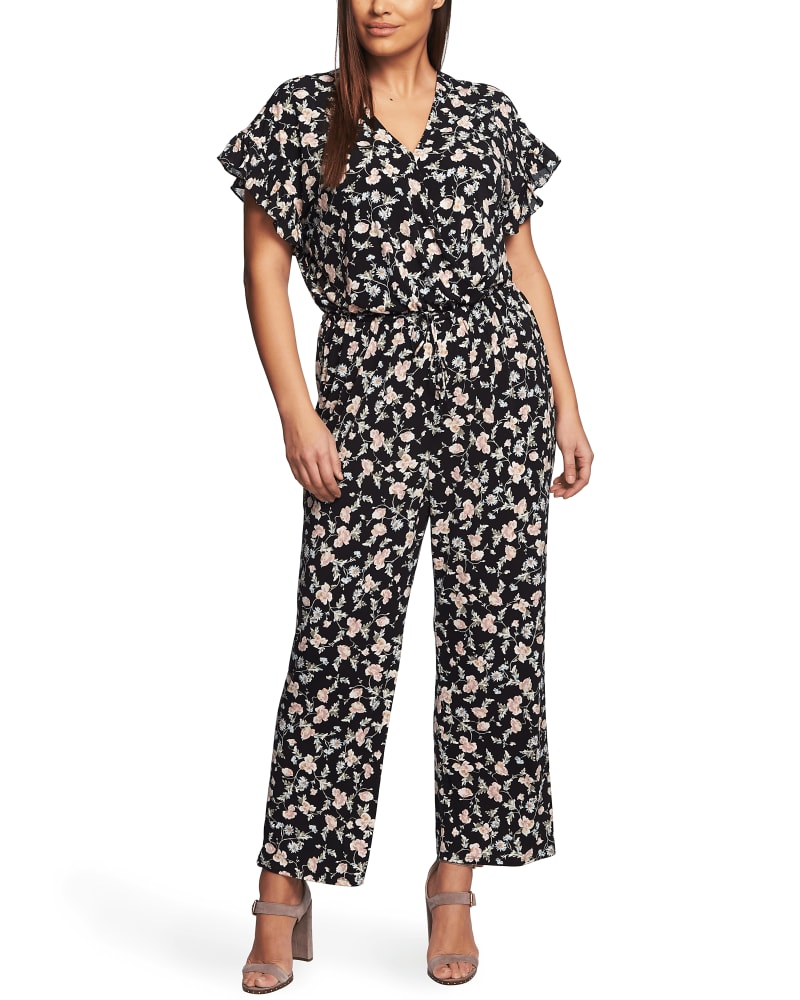 Front of a model wearing a size 1X Flora Ruffle Jumpsuit in RICH BLACK by CeCe. | dia_product_style_image_id:263920